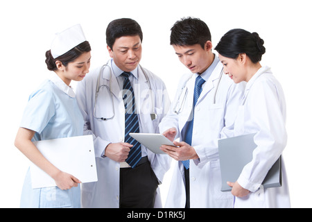 Professional medical team using digital tablet Stock Photo