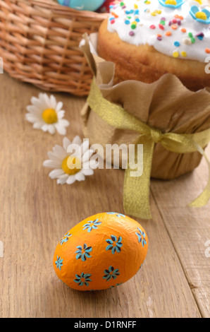 Easter decorations eggs cake and basket Stock Photo