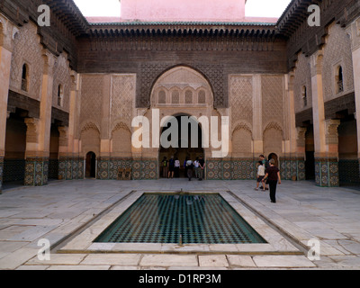 Ben Youssef Madrasa central courtyard with mosque entrance ahead Stock Photo