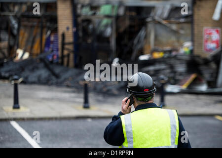 Triangle Shops, Laindon, Basildon, Essex. The day after a fire ripped through four businesses razing them to the ground. Council officials begin to assess the damage to the parade of shops they own and rent to the businesses.  Credit:  Allsorts Stock Photo / Alamy Live News Stock Photo