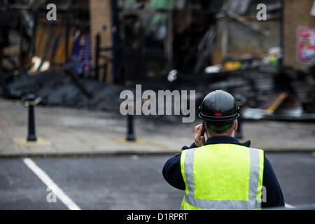 Triangle Shops, Laindon, Basildon, Essex. The day after a fire ripped through four businesses razing them to the ground. Council officials begin to assess the damage to the parade of shops they own and rent to the businesses.  Credit:  Allsorts Stock Photo / Alamy Live News Stock Photo