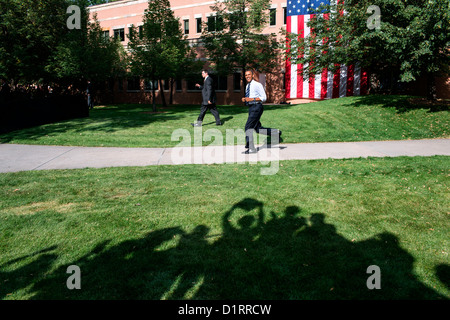 US President Barack Obama smiles as he passes cheering supporters on his way to the stage at an outdoor campaign rally at Colorado State University August 28, 2012 in Fort Collins, CO. Stock Photo