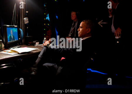 US President Barack Obama watches former President Bill Clinton speak from backstage at the Democratic National Convention September 5, 2012 in Charlotte, NC. Stock Photo