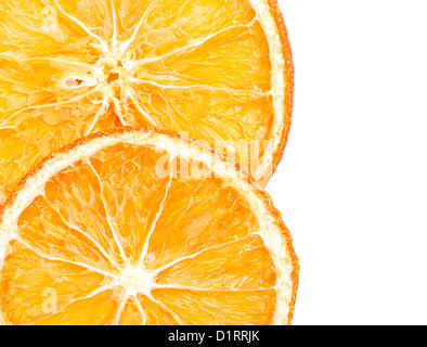 Two slices of dried orange on white background Stock Photo