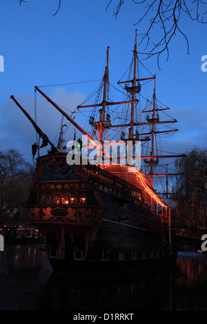 The pirate frigate on the Tivoli Lake at the Christmas market in Copenhagen, Denmark. A family restaurant called Pirateriet. Stock Photo