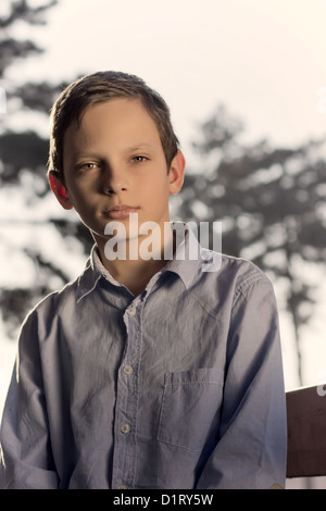 outdoor portrait of young boy looking at camera Stock Photo