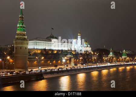 Kremlin Wall that surrounds the Moscow Kremlin, with the characteristic towers is seen from a bridge crossing Mosow River Stock Photo