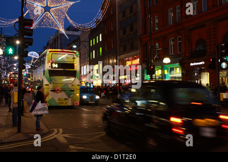 buses, taxis and people in Oxford Street, London Stock Photo