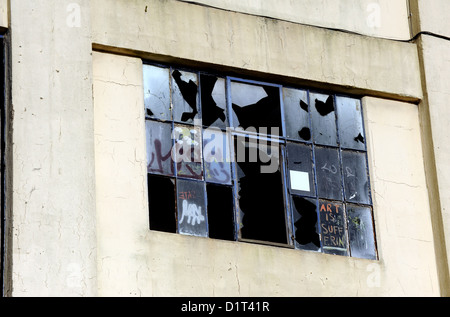 Ipswich UK - Broken smashed windows in a derelict building Stock Photo