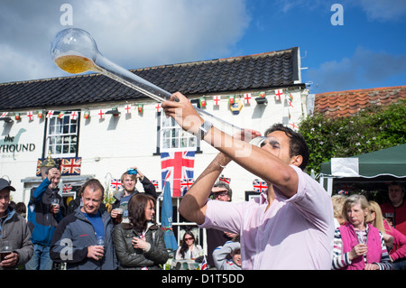 Young Man Drinking Yard of Ale at Village Pub During Queen's Diamond Jubille Celebrations Stock Photo