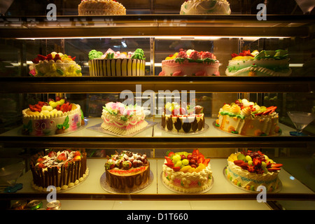 Chinese style cakes in Chinese bakery in Chinatown, London, UK Stock Photo