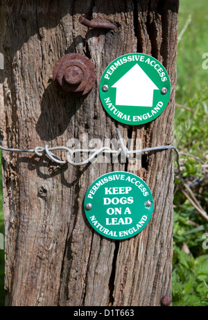 Permissive access and keep dogs on lead signs on a footpath Stock Photo