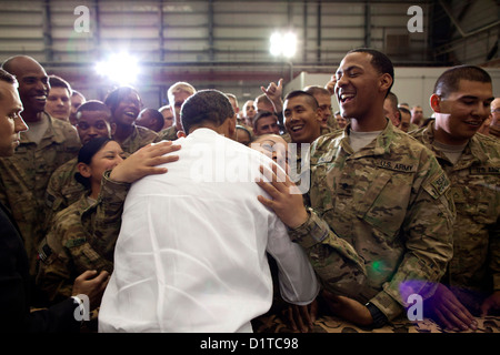 US President Barack Obama hugs a soldier during a visit to troops May 1, 2012 at Bagram Air Field in Afghanistan. Stock Photo