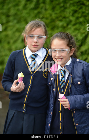 School girls during an outdoor rocket launch science lesson at Our Lady & St. Werburgh's Catholic Primary School in Newcastle-un