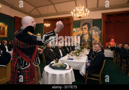 Addressing the haggis at a traditional Burns Night Supper Stock Photo