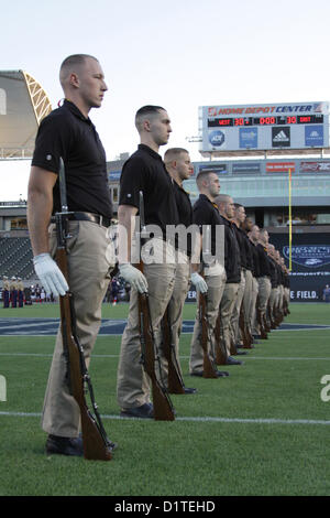 Marines with the Silent Drill Platoon practice drill movements before the Semper Fidelis All-American Bowl at the Home Depot Center in Carson, Calif., Dec. 4. The Semper Fidelis All-American Bowl is the culmination of the Marine Corps' Semper Fidelis Football Program, through which the Marine Corps purposefully engages with well-rounded student athletes to share leadership lessons that will enable success in the future. (U.S. Marine Corps photo by Lance Cpl. Rebecca Eller) Stock Photo