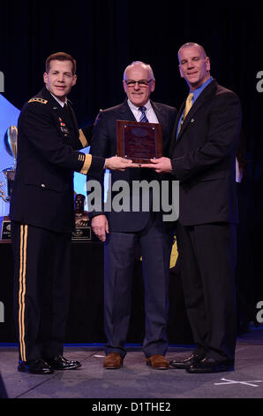 Lt. Gen. Jefferey Talley, Chief of the U.S. Army Reserve and commanding general of U.S. Army Reserve Command, gives the National Coach of the Year Award to Brian Hales at Marriott Rivercenter Hotel in San Antonio Jan. 4, 2013. (U.S. Army Reserve photo by Pfc. Victor Blanco, 205th Public Affairs Operations Center) Stock Photo