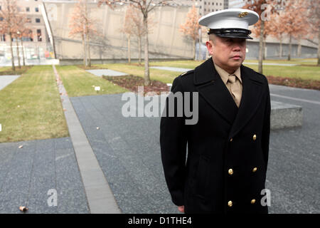 NEW YORK – Master Gunnery Sgt. Fernando San Luis, a member of the 1st Marine Corps District’s Contact Team, stands at attention inside the 9/11 Memorial here during his promotion ceremony Jan. 4.  San Luis, a native of Guam, chose to have his promotion ceremony at the memorial to make his last promotion memorable and pay respects to those lost on Sept. 11, 2001.  (U.S. Marine Corps photo by 1st Lt. Timothy R. Irish). Stock Photo