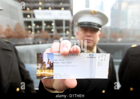 NEW YORK – Master Gunnery Sgt. Fernando San Luis, a member of the 1st Marine Corps District’s Contact Team, shows off the last piece of paper he received with the rank master sergeant before his name.  San Luis, a native of Guam, was promoted to his current rank at a promotion ceremony inside the 9/11 Memorial here Jan. 4.  (U.S. Marine Corps photo by 1st Lt. Timothy R. Irish). Stock Photo