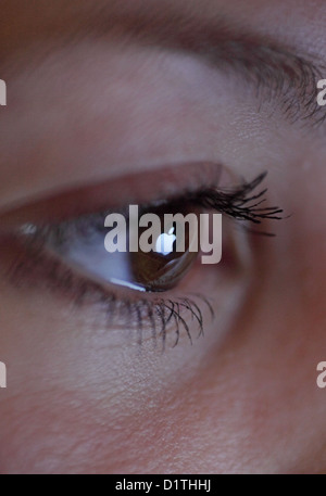 Berlin, Germany, mirroring the Apple logo in the eye of a woman Stock Photo