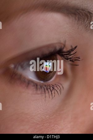 Berlin, Germany, mirroring the Apple logo in the eye of a woman Stock Photo