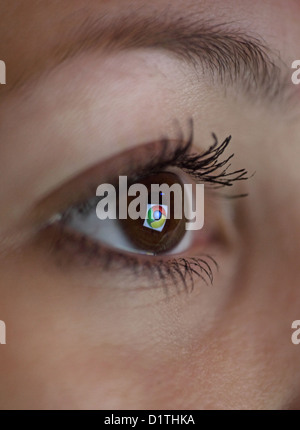 Berlin, Germany, mirroring the Google Chrome logo in the eye of a woman Stock Photo