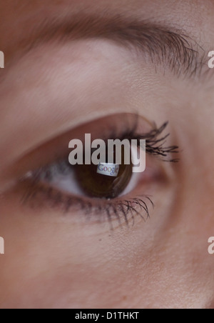 Berlin, Germany, mirroring the Google logo in the eye of a woman Stock Photo