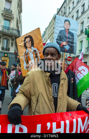 Paris, France,Portrait Man holding Protest Sigh, Aliens Without Papers, Sans papiers  Protesting, African Immigrants Marching with Banners, Demonstration, europe migrants, immigrant worker france, undocumented people,  PORTRAIT OF GUY ON STREET Stock Photo