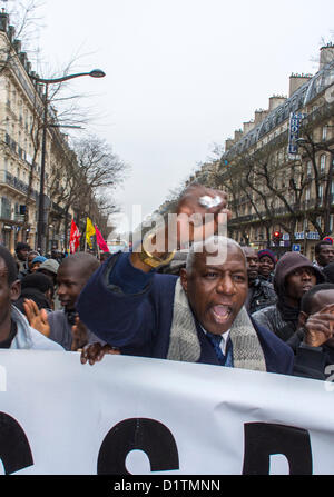 Paris, France, Aliens Without Papers, Sans papiers,  Protesting French Government, African Immigrants Marching with Banners, migrants workers discrimination, immigrants rights, Man fist in air, undocumented people Stock Photo