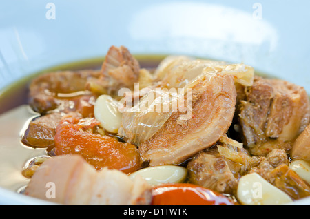 stewed pork knuckle with tomato and herb , asian style food Stock Photo