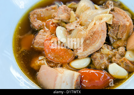 top view stewed pork knuckle with tomato and herb Stock Photo