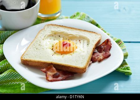 Heart shaped fried egg in toast Stock Photo