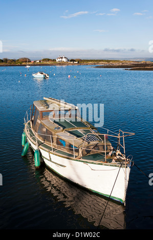 An Old White Hulled Cabin Cruiser Moored in Groomsport Harbour County Down Northern Ireland United Kingdom UK Stock Photo
