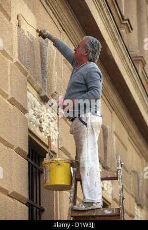 Budapest, Hungary, painter painting a house facade