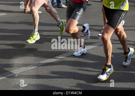 Berlin, Germany, the marathon runners cast their shadows on the road Stock Photo
