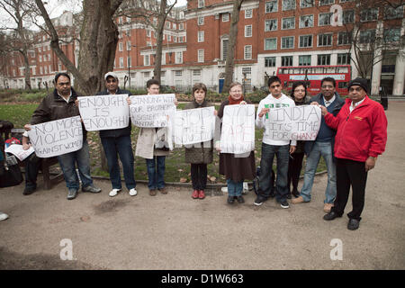 London, Saturday 5 January 2013. Candle Lighting Memorial at Mahatma Gandhi Statue, Tavistock Square Garden in London-Save our Sisters. Protesters gathered at Tavistock Garden Square to protest and show their solidarity against the incident that took place in Delhi, The Indian capital, where a female was gang-raped and thrown out of the moving bus to die. NRI Indians In London want an answer from the Indian Government for what has happened. Protesters were seen holding placards at the place of the demonstration. Stock Photo