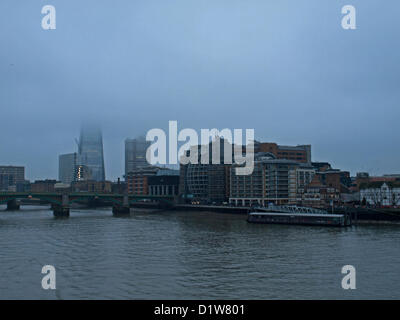 The top of the Shard is obscured by a blanket of fog on 6th January, 2013, London, England, United Kingdom. The Shard London Bridge is the tallest building in the European Union. Its viewing platform will open to the public on the 1st of February 2013. Stock Photo