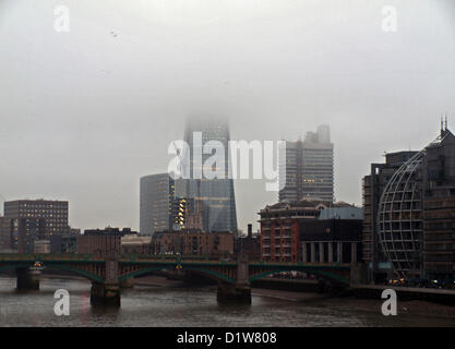 The top of the Shard is obscured by a blanket of fog on 6th January, 2013, London, England, United Kingdom. The Shard London Bridge is the tallest building in the European Union. Its viewing platform will open to the public on the 1st of February 2013. Stock Photo