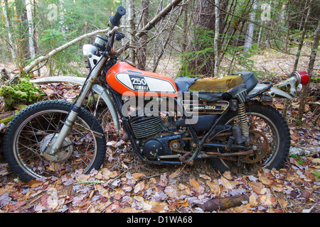 Abandoned Yamaha 250 motorcycle near the Mt Cilley Trail in Woodstock, New Hampshire USA Stock Photo