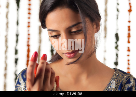 Indian bride wearing bangles Stock Photo