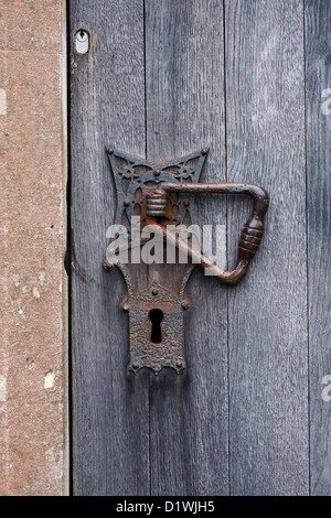 Modern and old locks on a door in an English church. Stock Photo