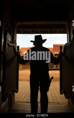 COWBOY STANDING IN DOORWAY OF SALOON ALLEN STREET TOMBSTONE COCHISE COUNTY ARIZONA USA Stock Photo