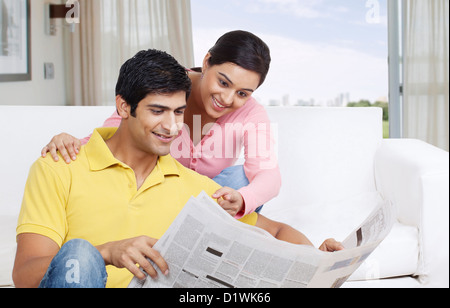 Couple reading the newspaper Stock Photo