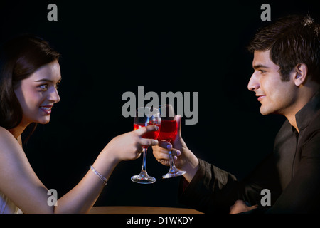 Couple having drinks in a restaurant Stock Photo
