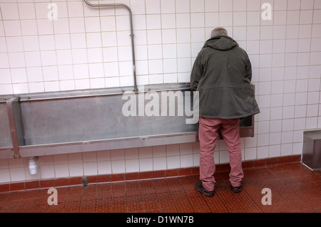 Man using urinal hi-res stock photography and images - Alamy