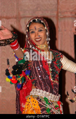 A colourful Rajasthani dancer performing a traditional folk dance at the Lalgarh Palace Hotel in Bikaner, Rajasthan, India. Stock Photo