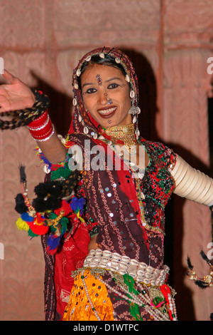 A colourful Rajasthani dancer performing a traditional folk dance at ...