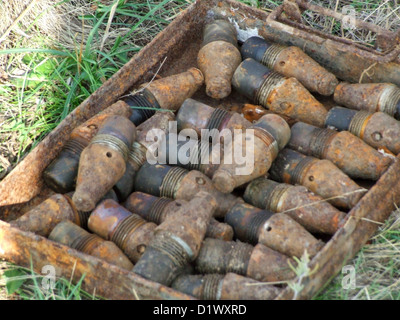 an unexploded bomb from World War II found in the ground Stock Photo