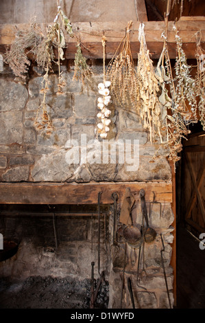 Replica of everyday items found in a 17th century French Jesuit Mission refectory, dining room. Stock Photo