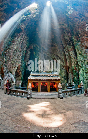 Marble Mountains, ray of light illuminating Huyen Khong cave. Danang, Vietnam Stock Photo